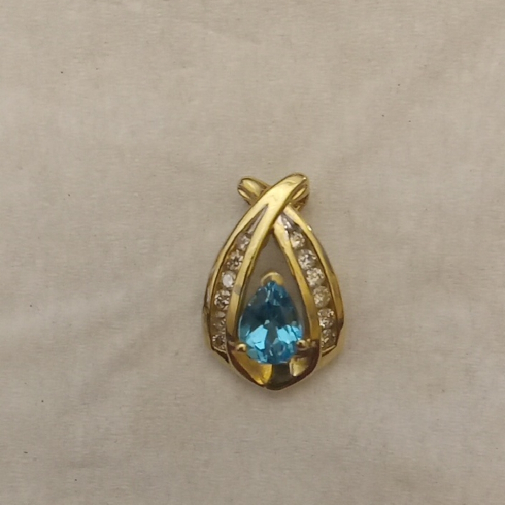 Elegant 10k Gold Pendant With Blue Teardrop Topaz Gemstone With 12 Diamonds
